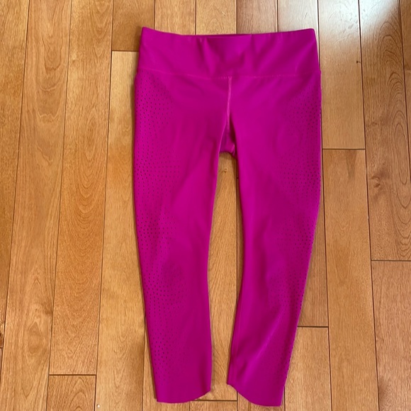 Athleta capri leggings; XS Petite; decorative hole embellishments; raspberry - Picture 1 of 6